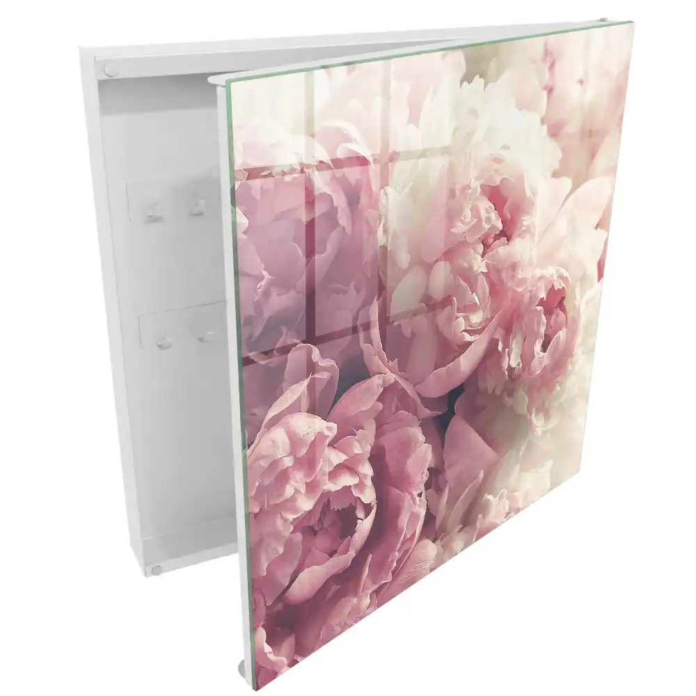 Boîte à clés murale des fleurs subtiles dans des tons de rose et de crème