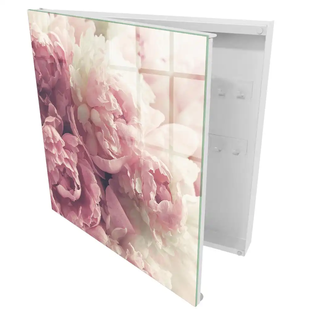 Boîte à clés murale des fleurs subtiles dans des tons de rose et de crème