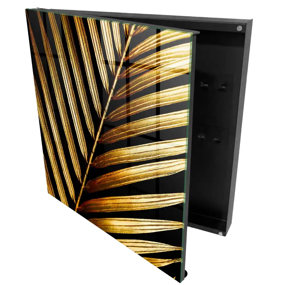 Armoire à clés feuilles dorées sur fond noir