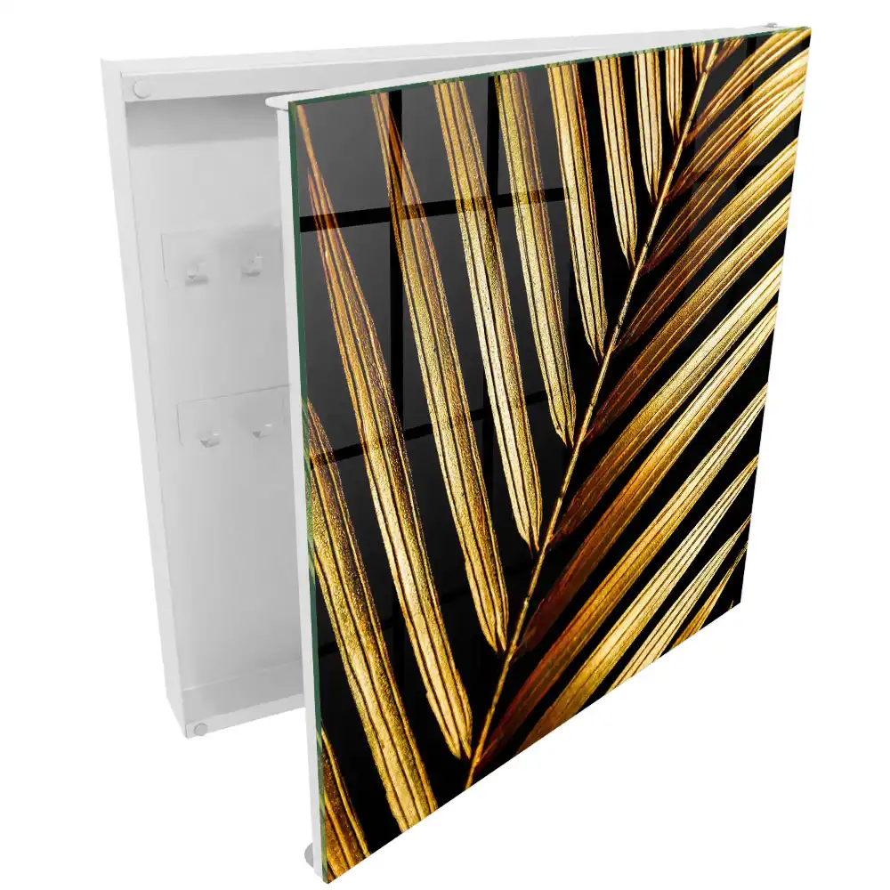 Armoire à clés feuilles dorées sur fond noir