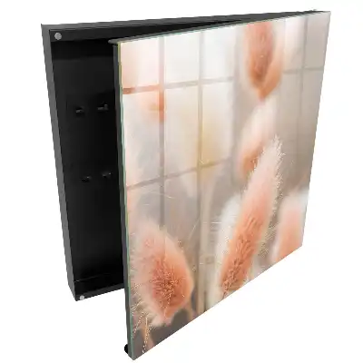 Boîte à clés murale de magnifiques plumes pastel dans un flou délicat