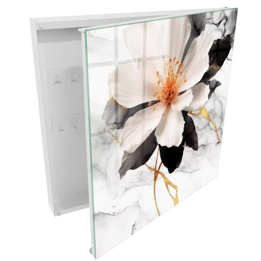 Boîte à clés fleur blanche sur fond gris avec une touche d'orange