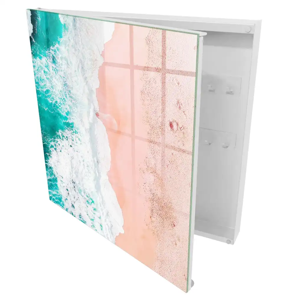 Boîte à clés vagues joyeuses sur fond de sable rose