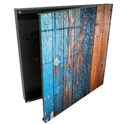 Armoire à clés fond en bois avec peinture bleue écaillée