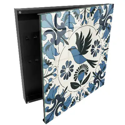 Armoire à clés un oiseau parmi des motifs dans des tons de bleu
