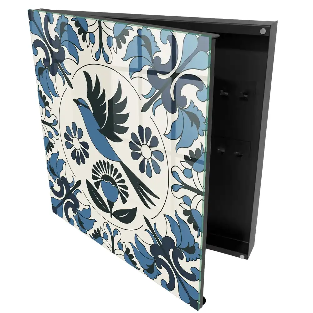 Armoire à clés un oiseau parmi des motifs dans des tons de bleu