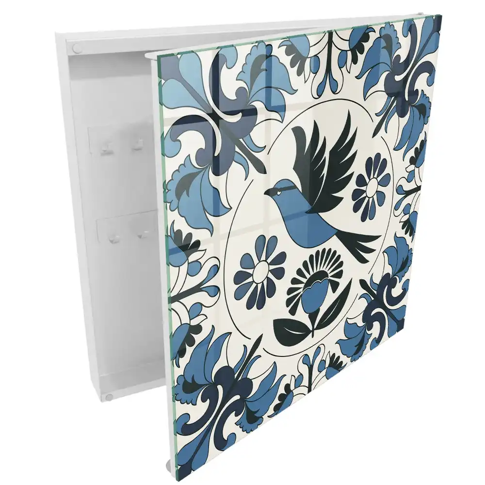 Armoire à clés un oiseau parmi des motifs dans des tons de bleu