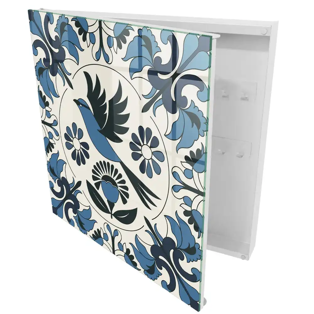Armoire à clés un oiseau parmi des motifs dans des tons de bleu