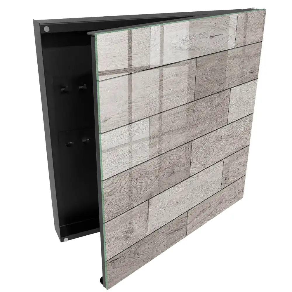 Armoire à clés motifs de bois dans des tons de gris avec une composition symétrique
