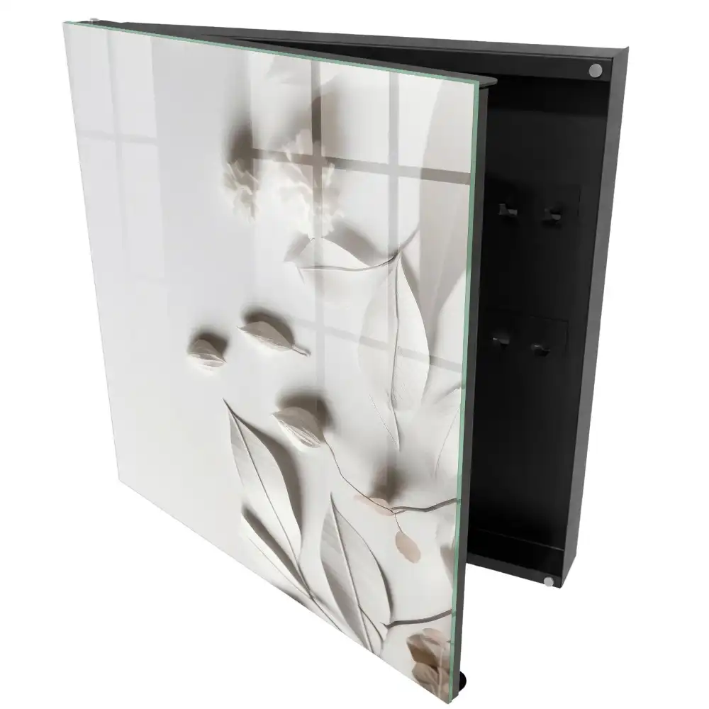 Armoire à clés feuilles délicates sur fond blanc