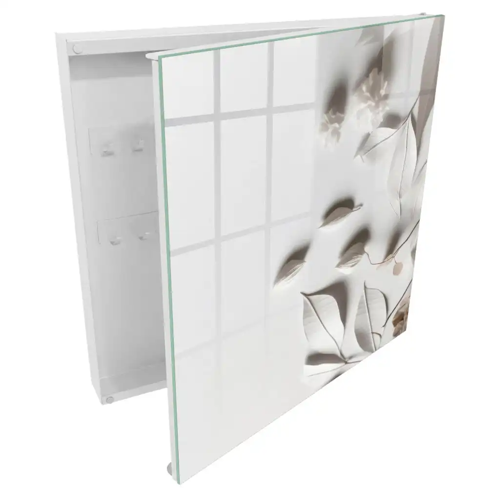 Armoire à clés feuilles délicates sur fond blanc