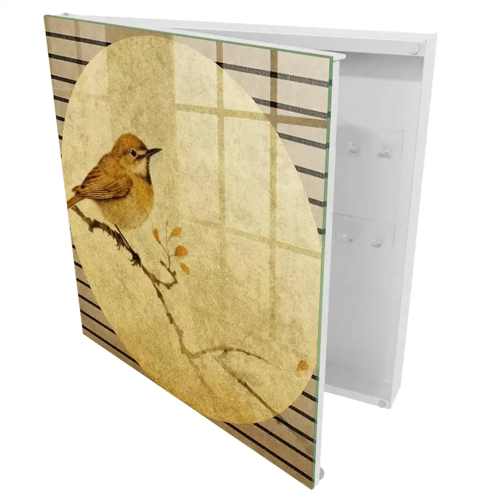 Armoire à clés un oiseau couleur crème sur une branche
