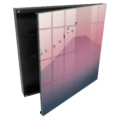 Armoire à clés une douce montagne et des oiseaux dans un ciel rose