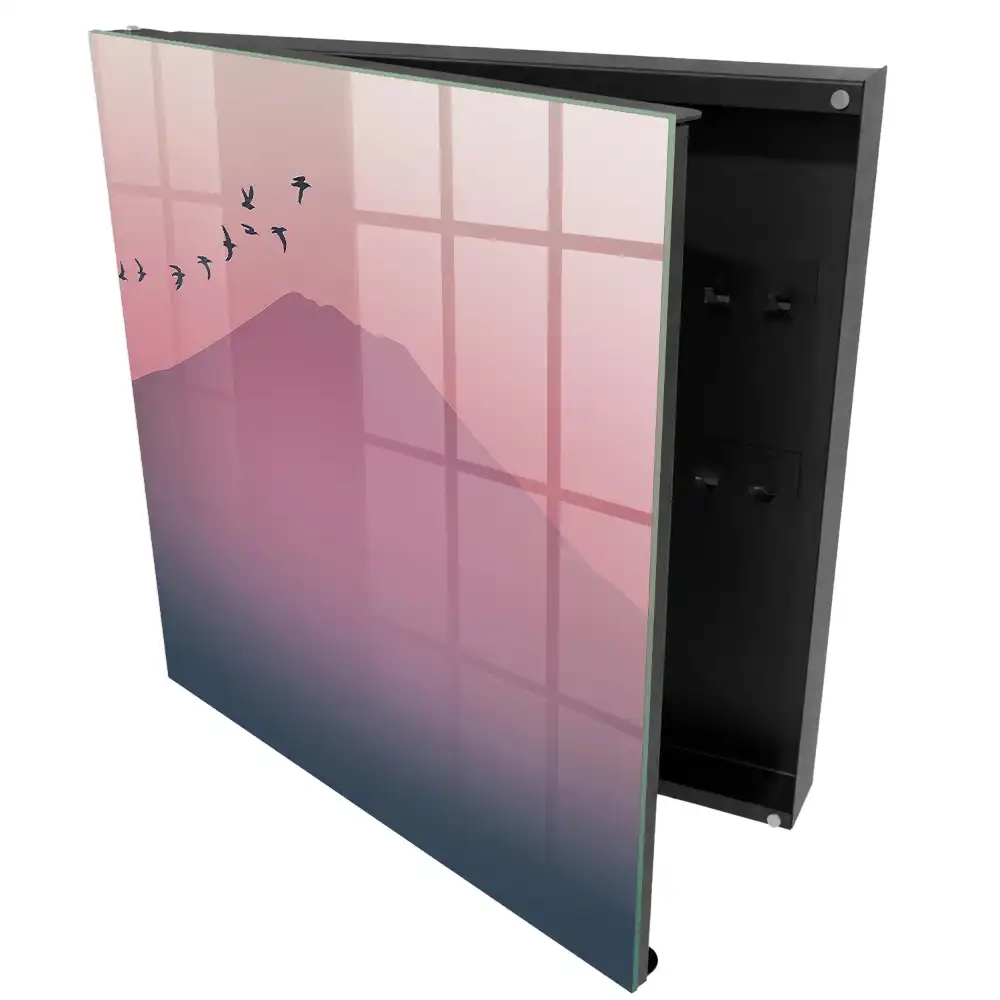 Armoire à clés une douce montagne et des oiseaux dans un ciel rose