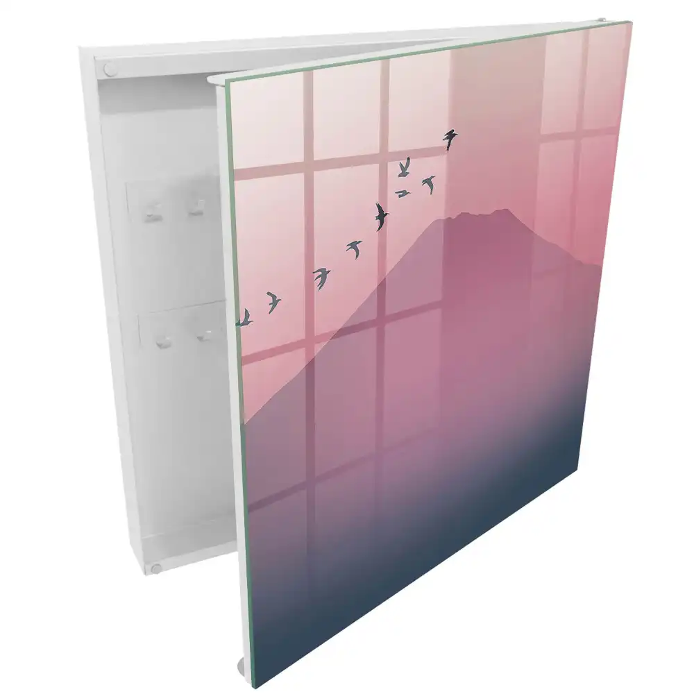 Armoire à clés une douce montagne et des oiseaux dans un ciel rose