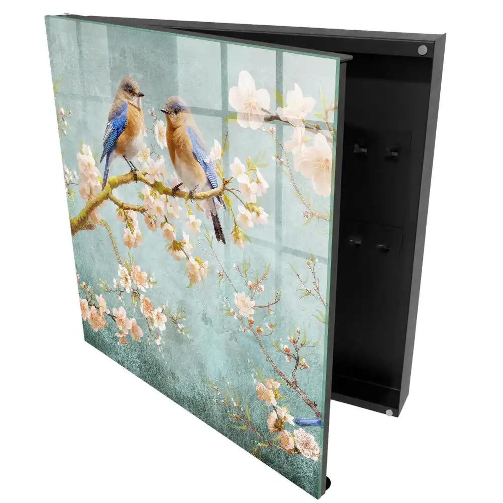 Armoire à clés oiseaux pastel sur une branche parmi les fleurs