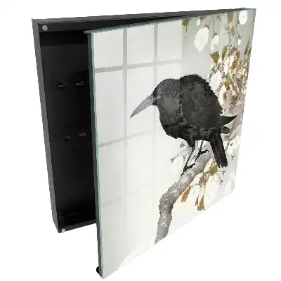 Armoire à clés un corbeau se détachant sur une branche fleurie
