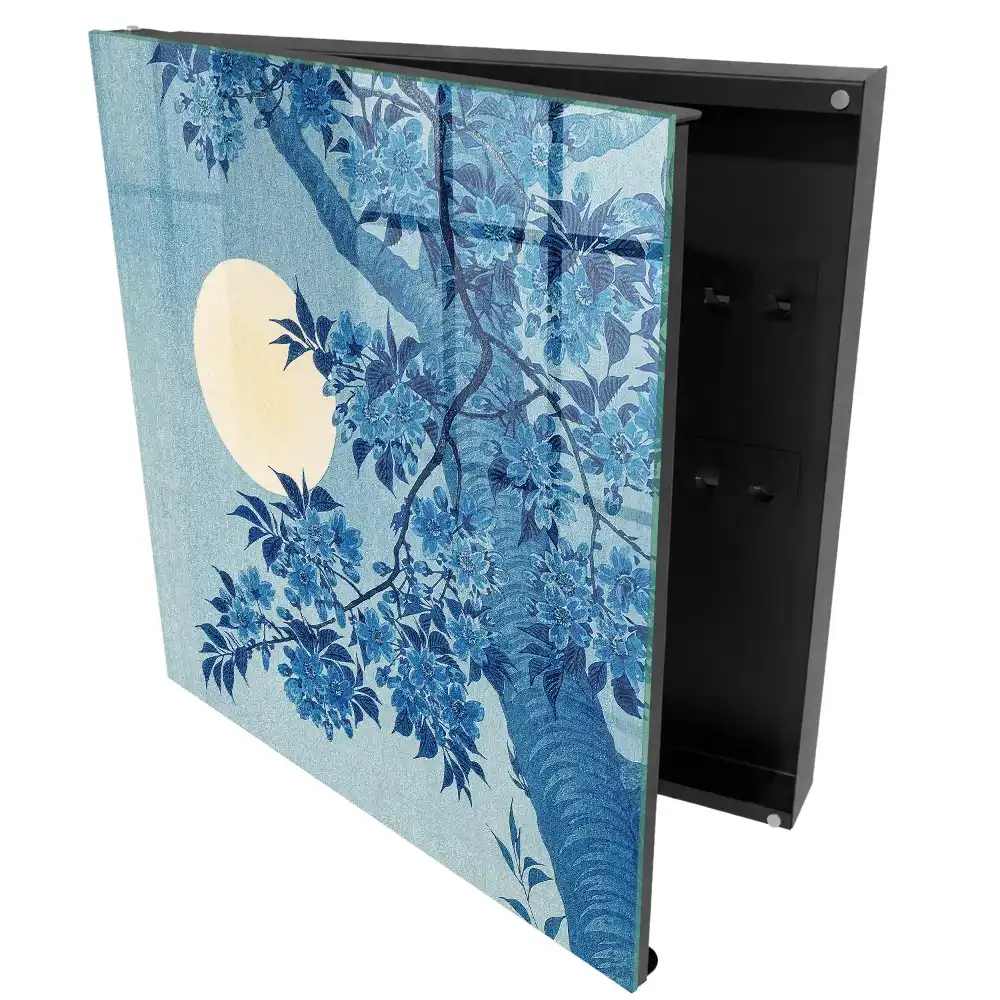 Boîte à clés des fleurs bleues sur fond de pleine lune