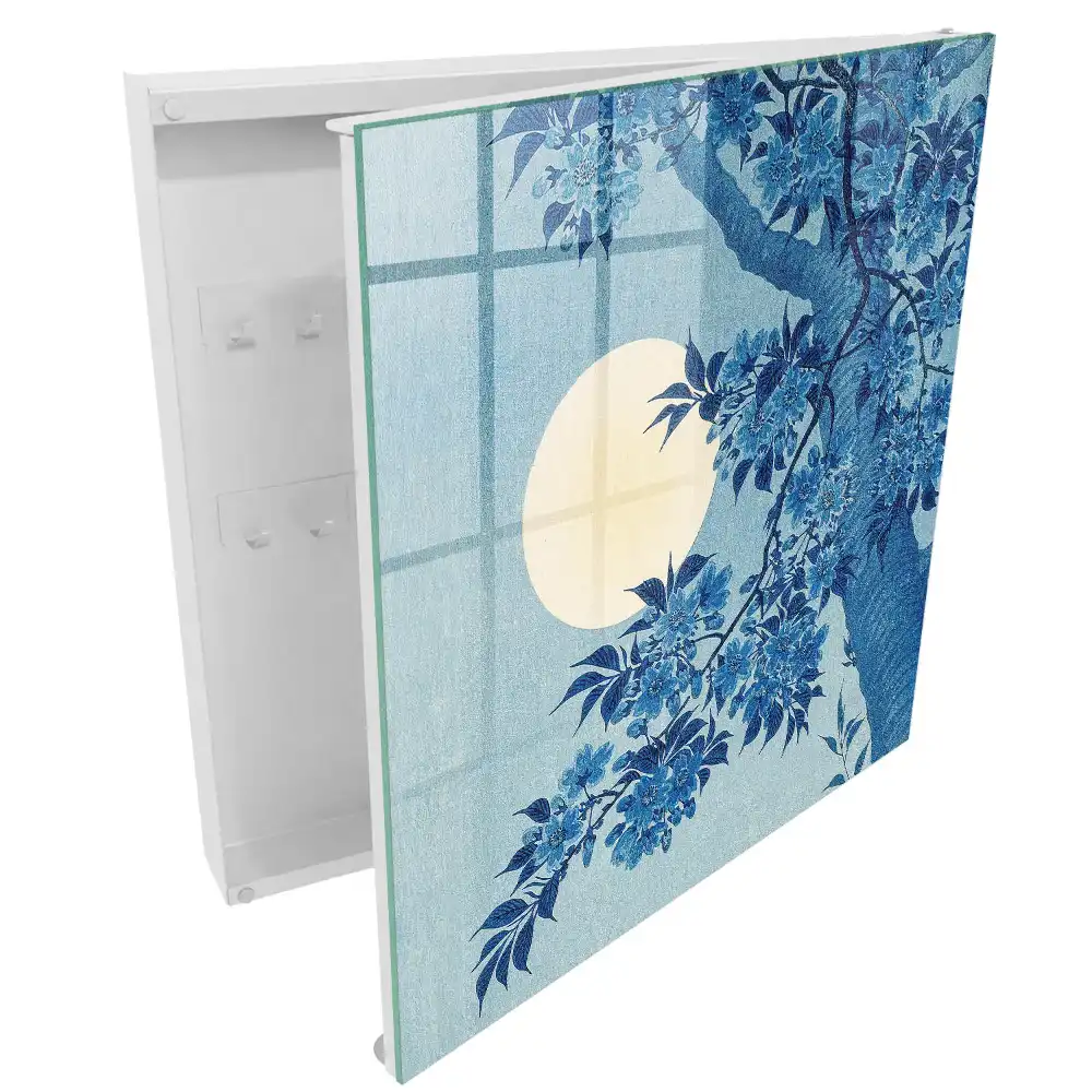 Boîte à clés des fleurs bleues sur fond de pleine lune