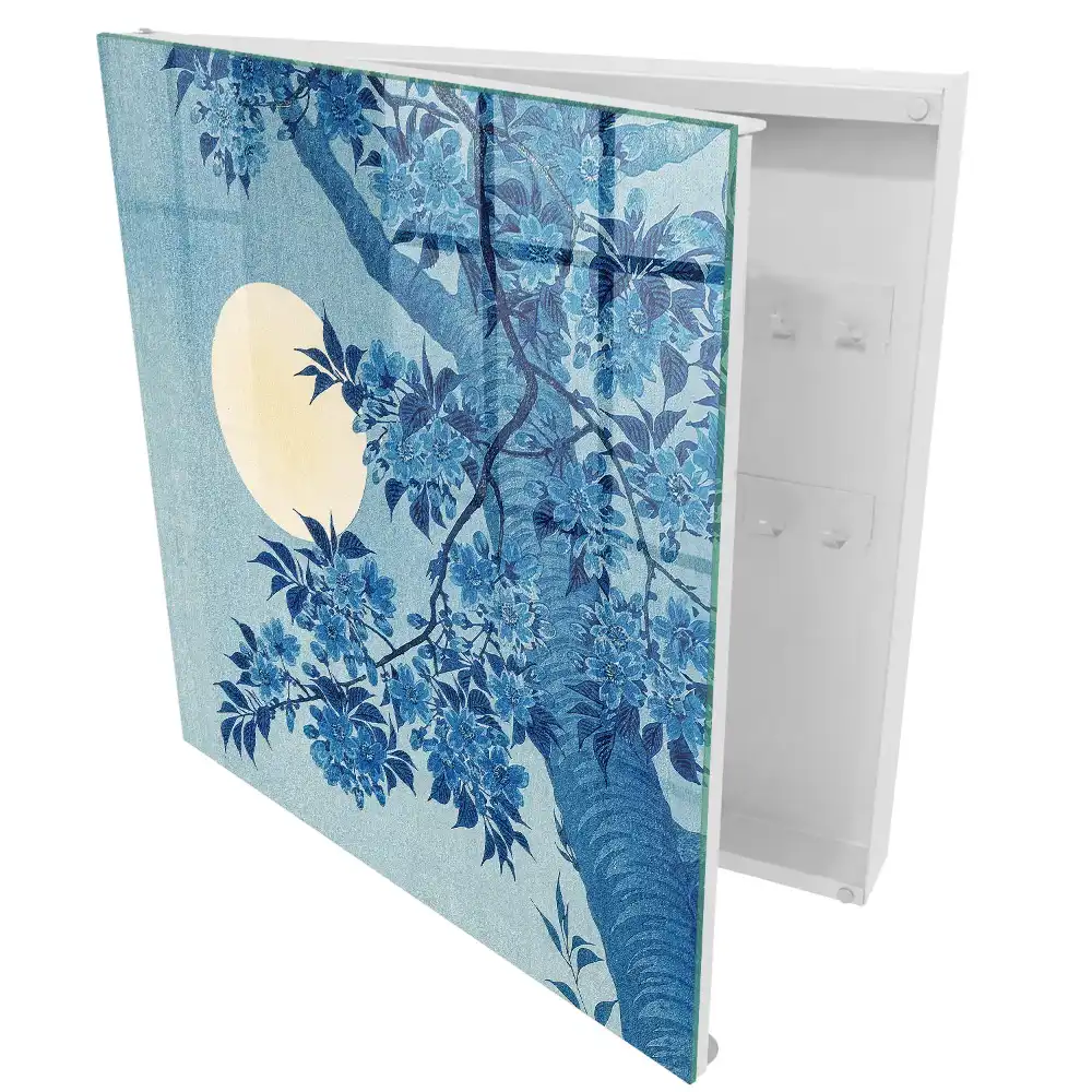 Boîte à clés des fleurs bleues sur fond de pleine lune