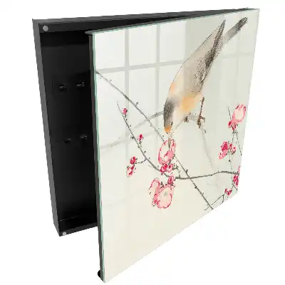 Boîte à clés un oiseau sur une branche des fleurs délicates un style subtil