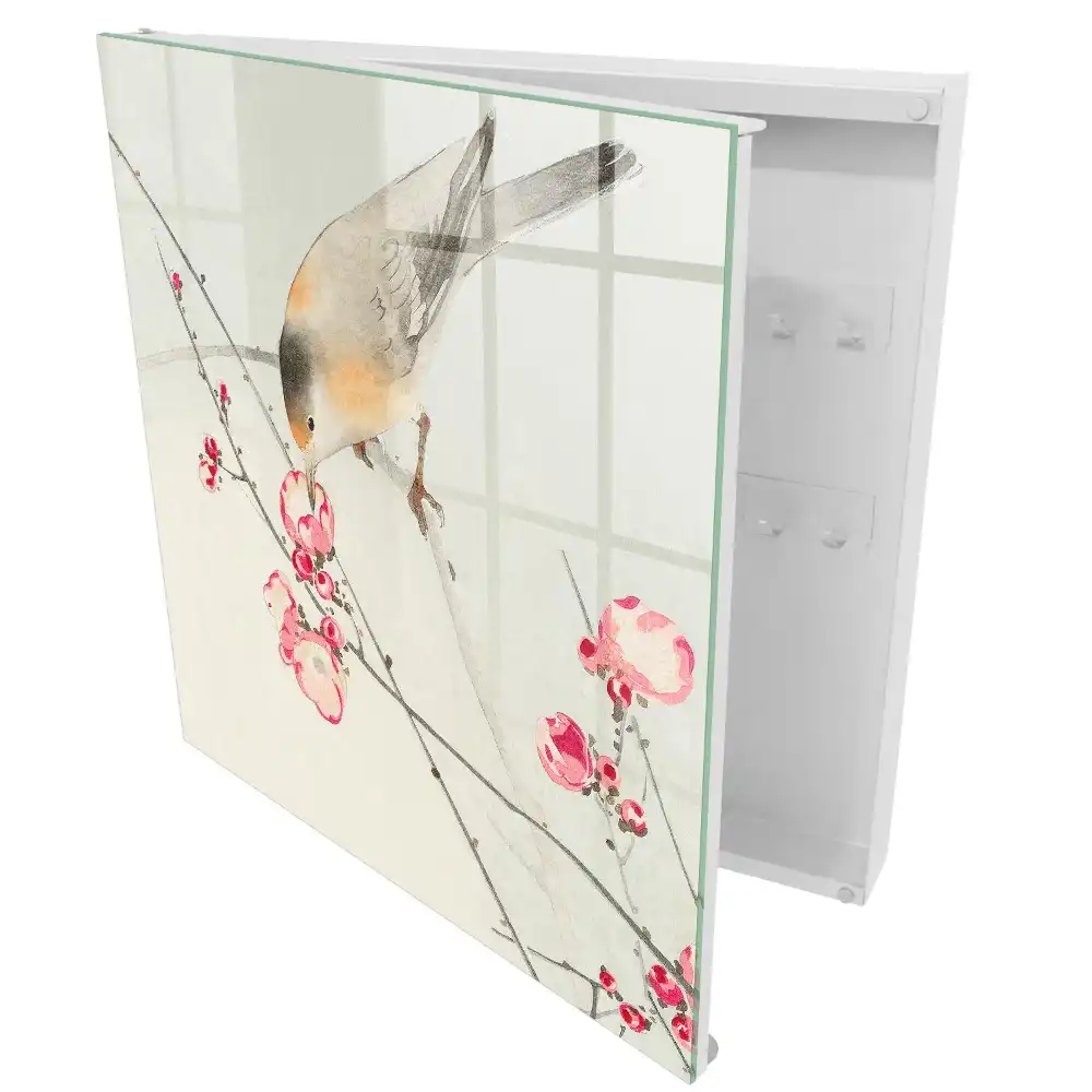 Boîte à clés un oiseau sur une branche des fleurs délicates un style subtil
