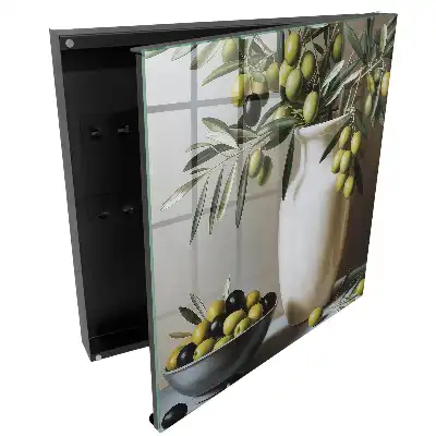 Armoire à clés une olive dans un vase et un bol contrastant avec le blanc