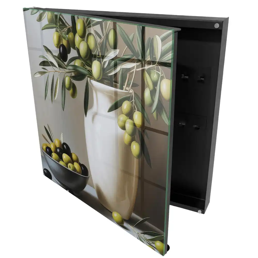 Armoire à clés une olive dans un vase et un bol contrastant avec le blanc
