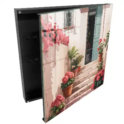 Boîte à clés des fleurs en pot sur l'escalier chaud