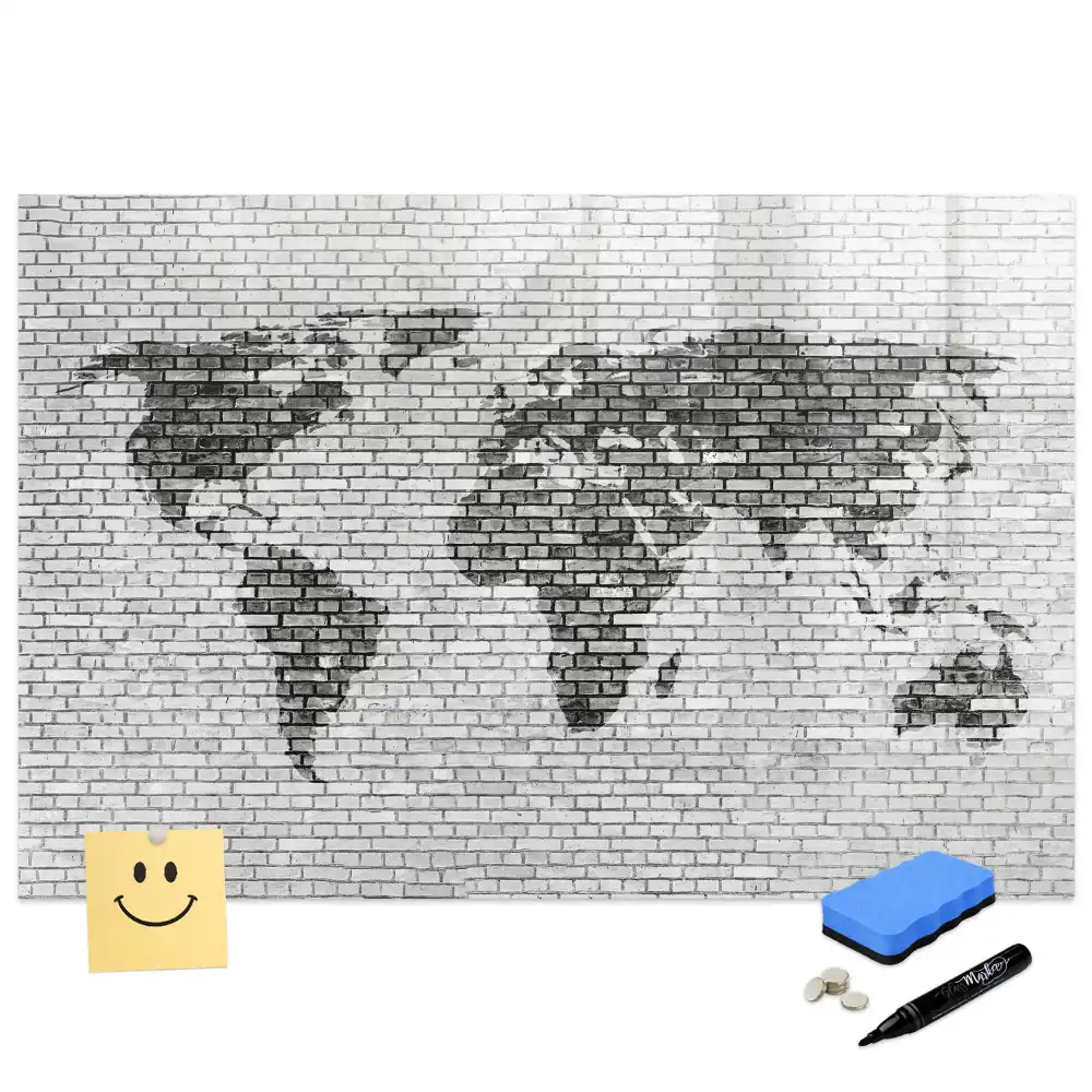 Tableau magnétique illustrant le monde sur fond de mur de briques